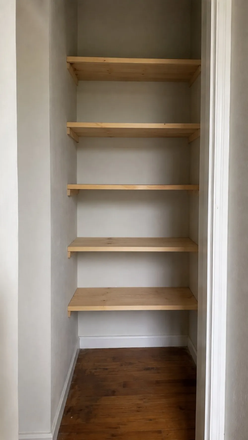 After — fitted timber alcove shelving in a Stockbridge flat